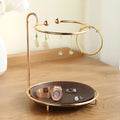 Walnut solid wood ring jewellery storage tray with electroplated iron accents on a flat surface