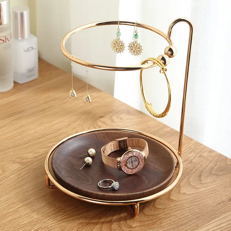 Walnut solid wood ring jewellery storage tray with electroplated iron accents on a flat surface