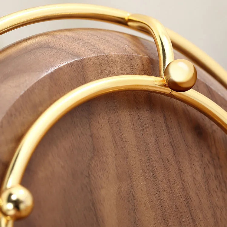 Walnut solid wood ring jewellery storage tray with electroplated iron accents on a flat surface