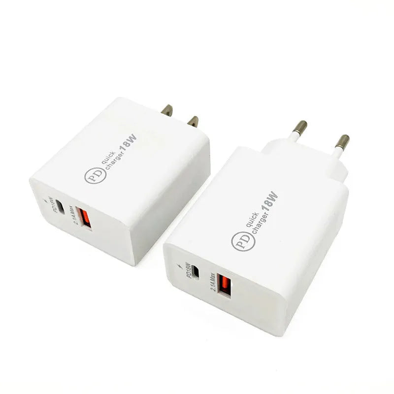 Black 18W USB-C fast wall charger with US plug next to a smartphone