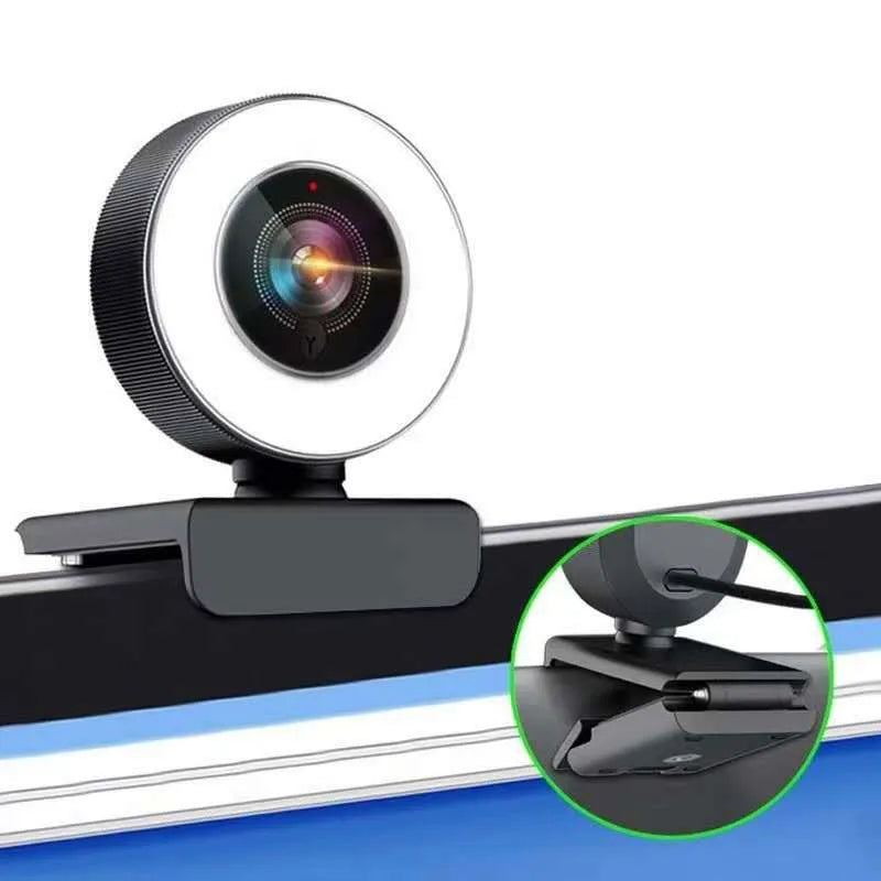 Black USB desktop webcam with a built-in fill light ring around the lens.