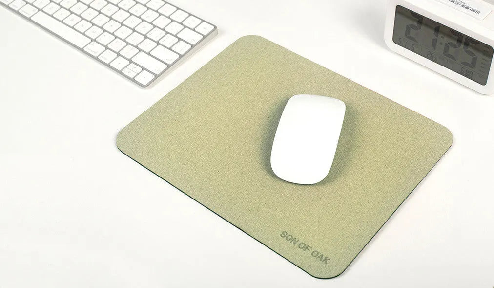 Cork portable mouse pad in green colour, 210x260x2.5mm size, lying flat on a desk surface