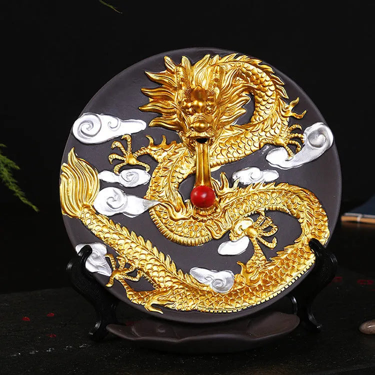 Ceramic backflow incense burner in Yellow Golden Dragon Plate colour on a table