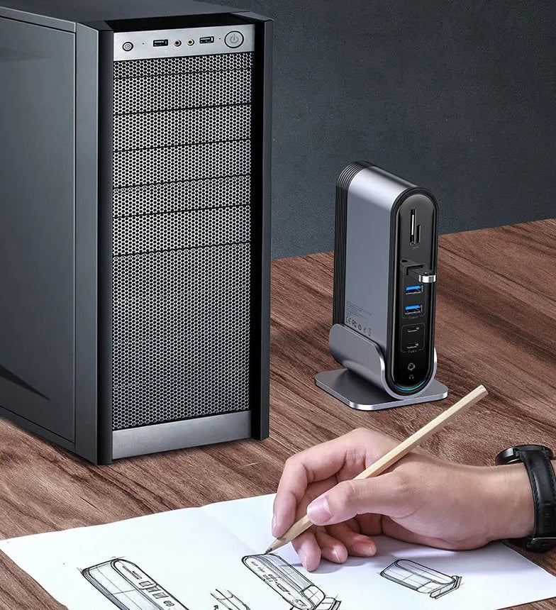 Deep space grey 16-in-1 Type-C docking station for laptops on a desk.