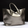 Cowhide leather women's shoulder bag with adjustable strap in black blue bronze silver or wine red colour