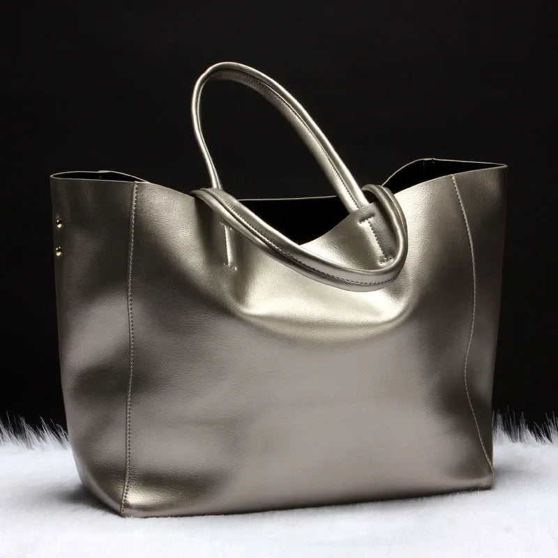 Cowhide leather women's shoulder bag with adjustable strap in black blue bronze silver or wine red colour