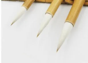 Three pure woolen hair Chinese writing brushes with bamboo handles in large, medium and small sizes