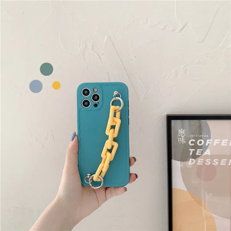 Colourful candy pink and light blue iPhone case with a chain attached to the side.
