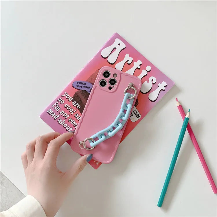 Colourful candy pink and light blue iPhone case with a chain attached to the side.