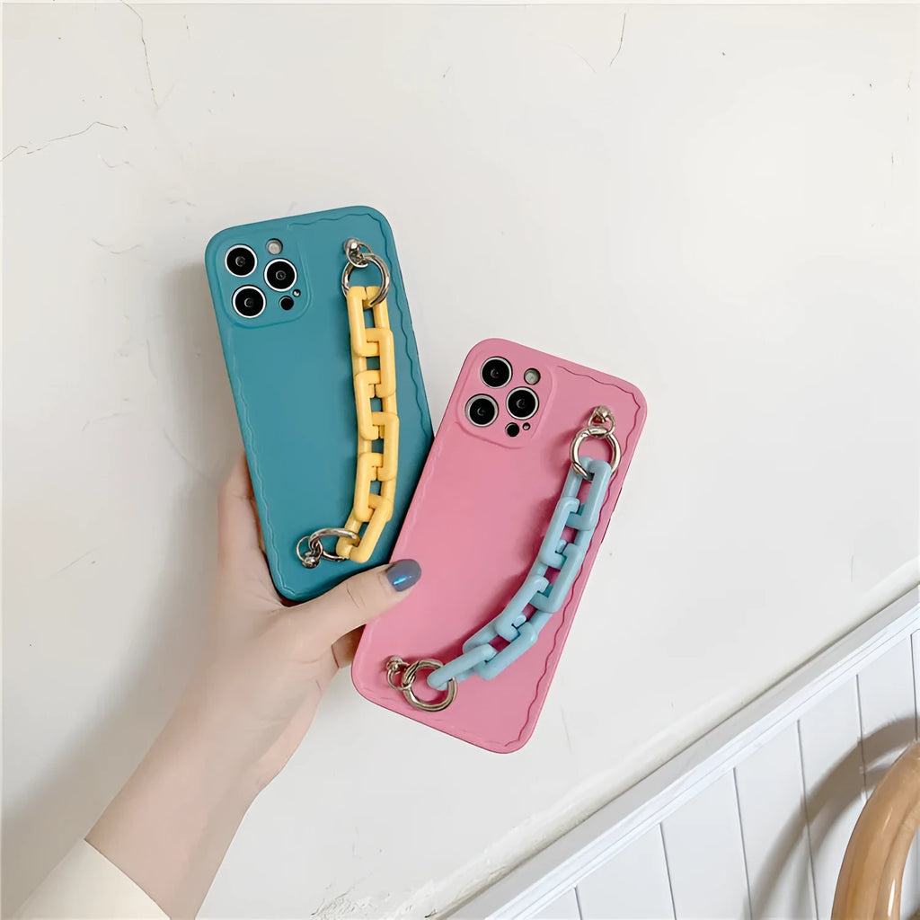 Colourful candy pink and light blue iPhone case with a chain attached to the side.