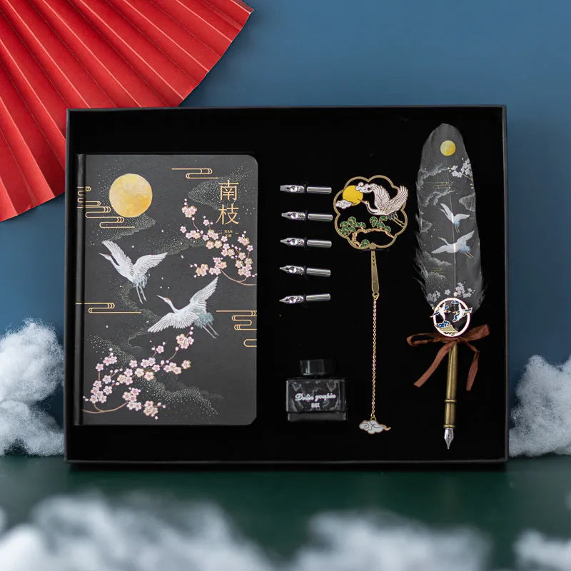 Chinese style metal notebook and feather pen set with 36 coloured quills in a gift box.