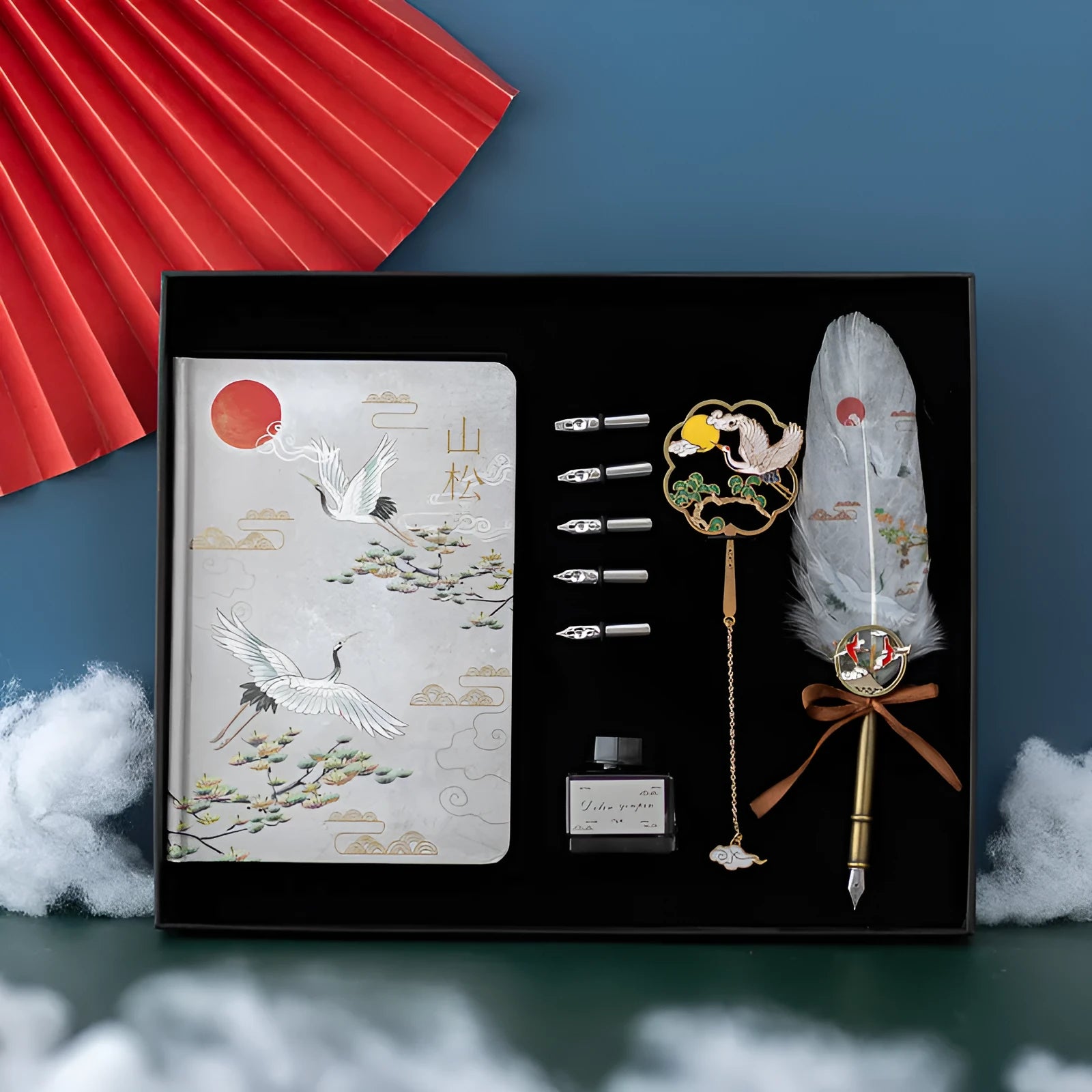 Chinese style metal notebook and feather pen set with 36 coloured quills in a gift box.