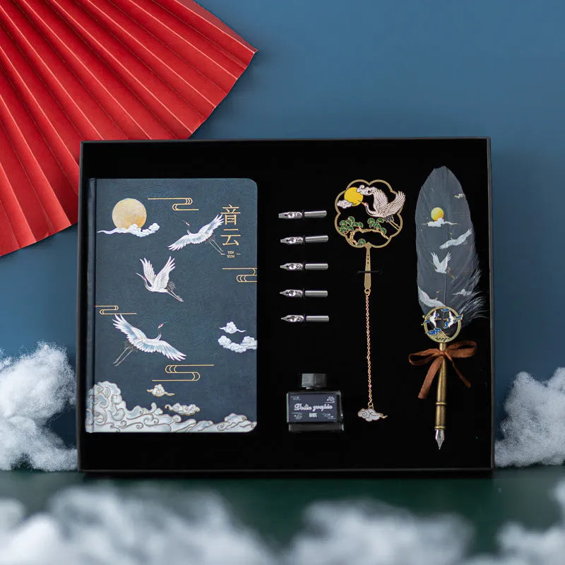 Chinese style metal notebook and feather pen set with 36 coloured quills in a gift box.