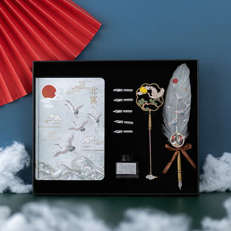Chinese style metal notebook and feather pen set with 36 coloured quills in a gift box.