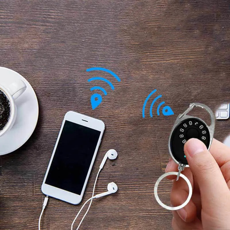 Black Apple-compatible Bluetooth tracker device with metal keychain loop for anti-lost tracking.
