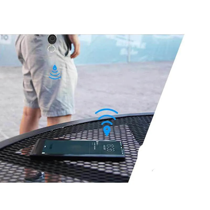 Black Apple-compatible Bluetooth tracker device with metal keychain loop for anti-lost tracking.