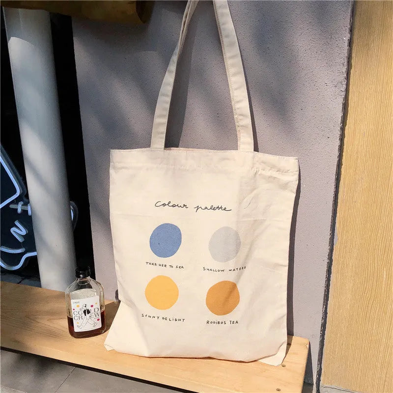 Women's canvas geometric print tote bag with zipper closure and double handles in light pink colour