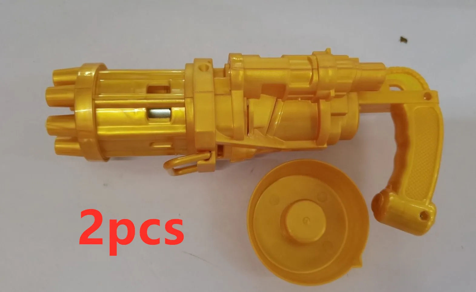 Kids pink bubble machine gun toy with leaf blower design on green grass