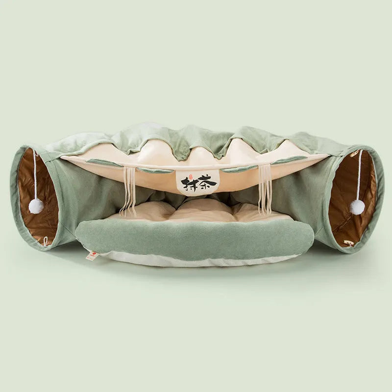 Collapsible cloth cat tunnel in Pink colour with visible opening, measuring 45x50x22 cm, on wooden floor