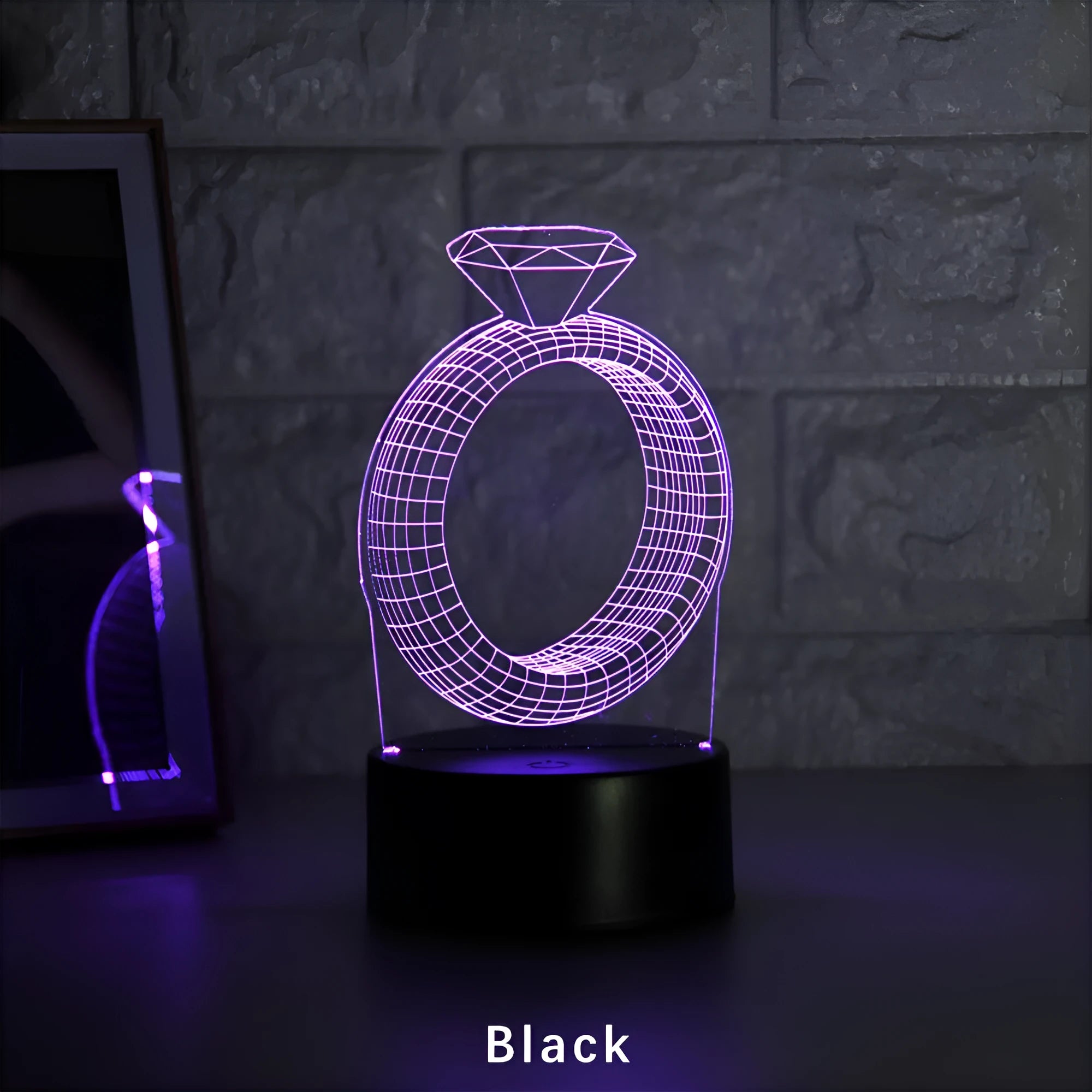 3D LED night light showing a holographic diamond ring design with colour-changing glow on a black base.
