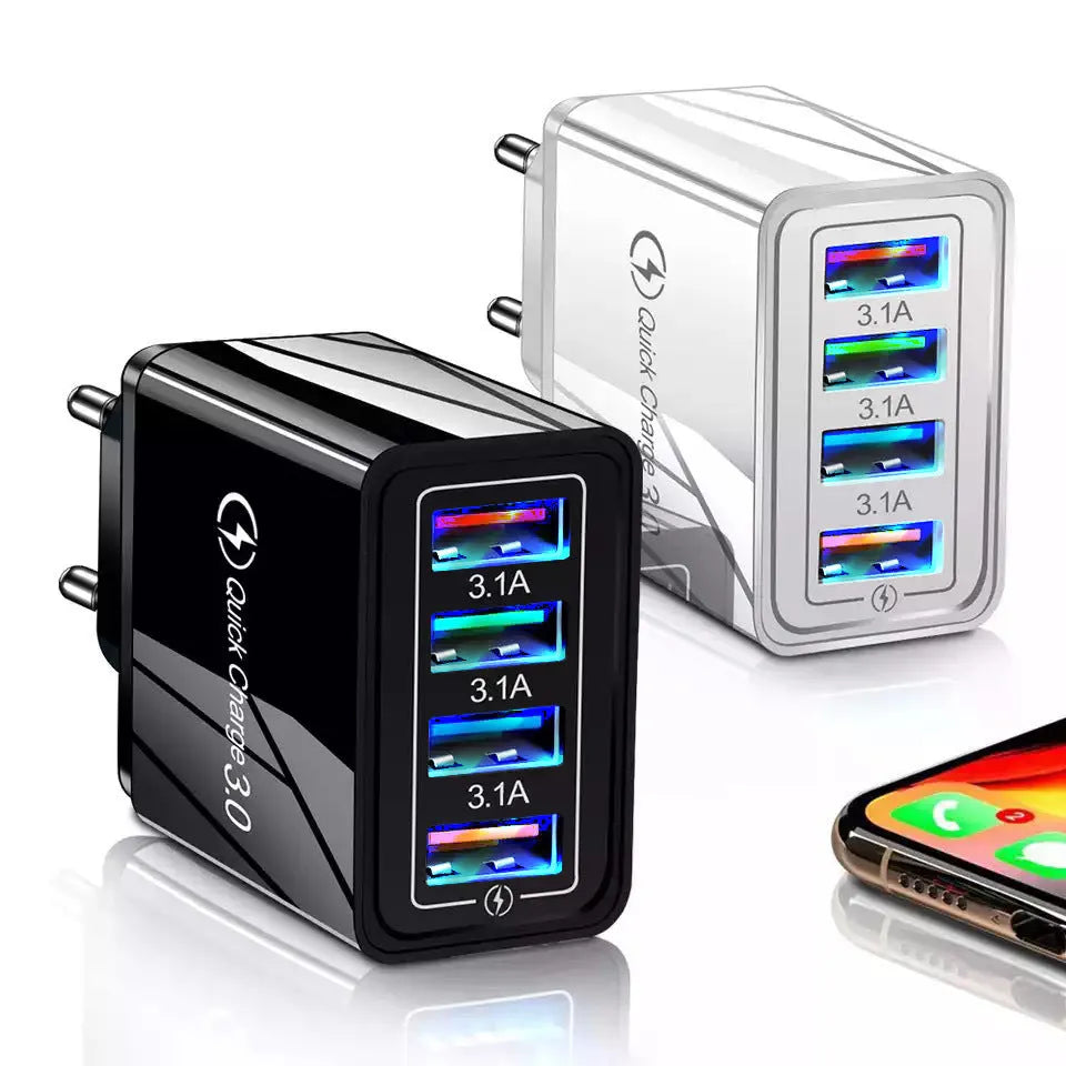 Simple Luminous 4-port USB wall charger in dark blue with LED light on, plugged into a socket.