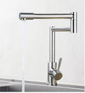 Silver stainless steel kitchen tap with rotating spout and dual hot cold handles