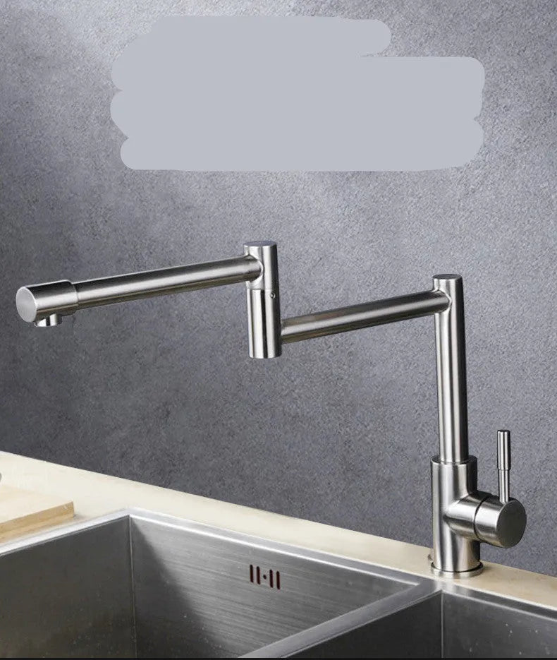Silver stainless steel kitchen tap with rotating spout and dual hot cold handles