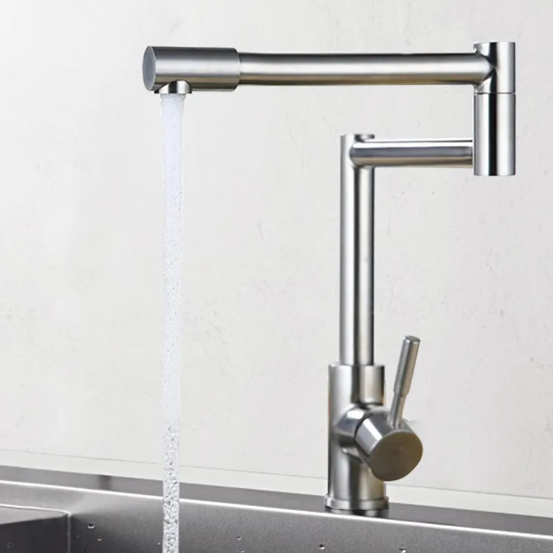 Silver stainless steel kitchen tap with rotating spout and dual hot cold handles