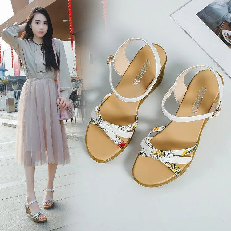 Women's pink wedge sandals with a thick heel, fish mouth design, and a single buckle.