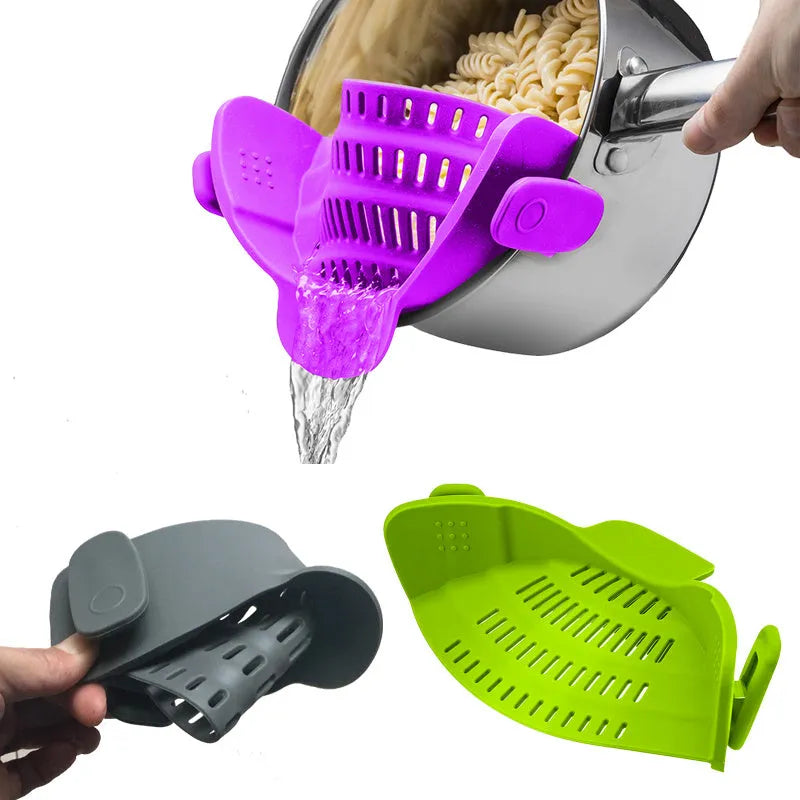 Silicone clip-on funnel strainer attached to a pot rim for draining liquids.