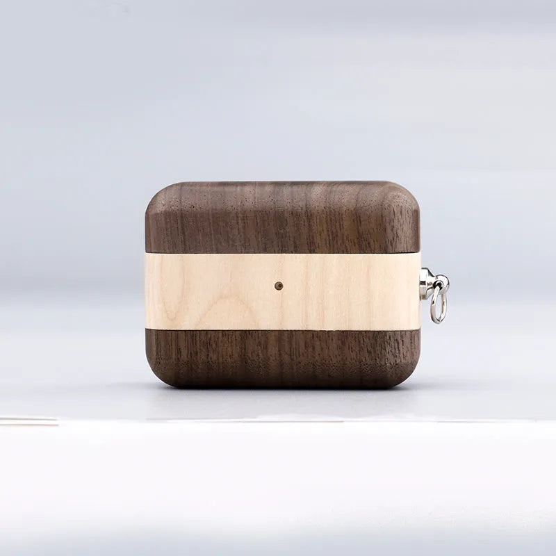 Carved solid wood sleeve for Bluetooth earphones in natural bamboo finish with lanyard loop.