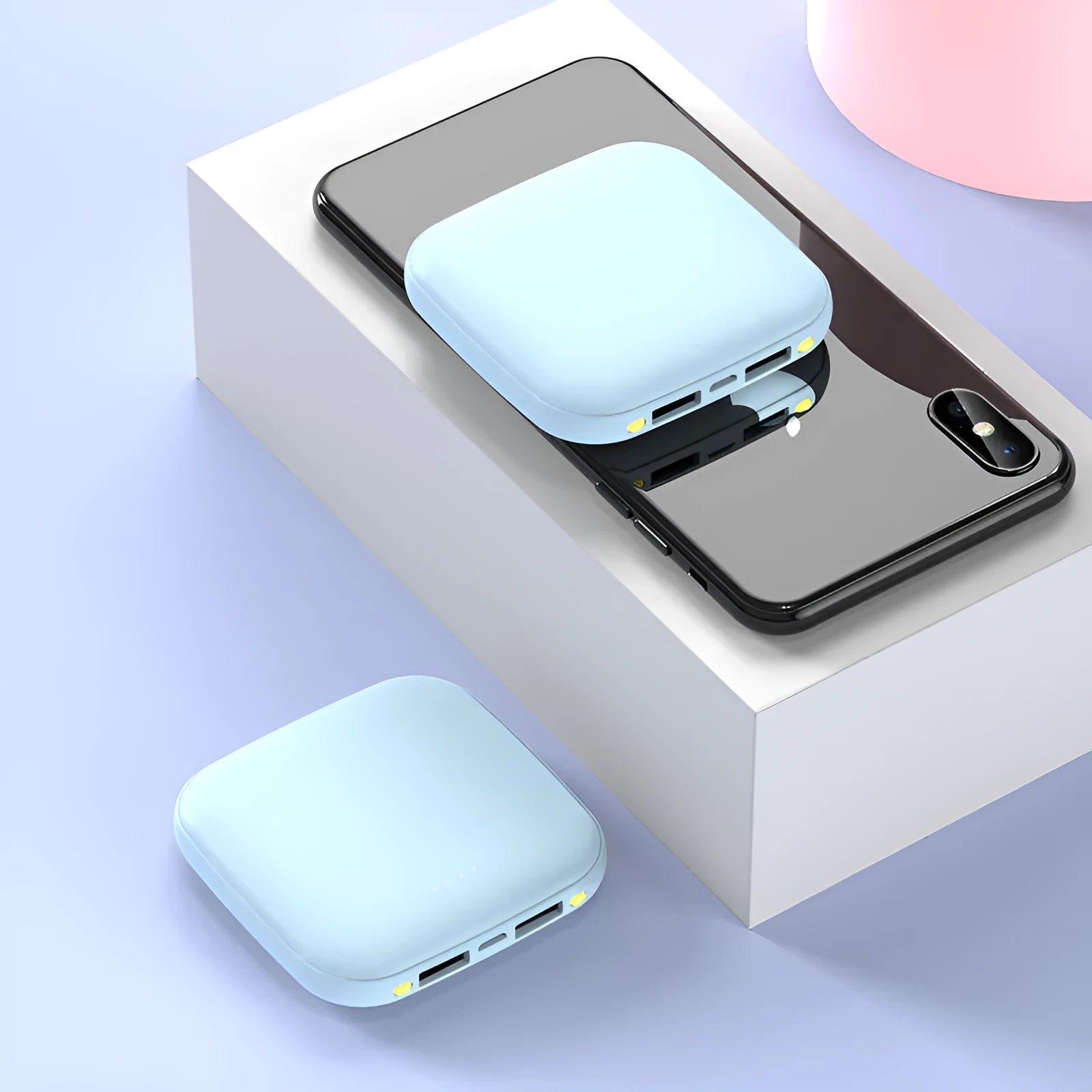 Square black mini power bank with 20000mAh capacity and a small LED flashlight on its side.