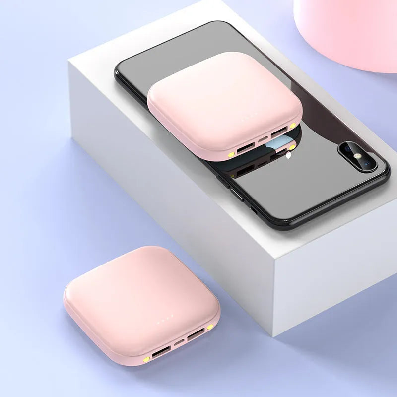 Square black mini power bank with 20000mAh capacity and a small LED flashlight on its side.