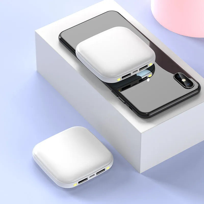 Square black mini power bank with 20000mAh capacity and a small LED flashlight on its side.
