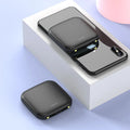 Square black mini power bank with 20000mAh capacity and a small LED flashlight on its side.