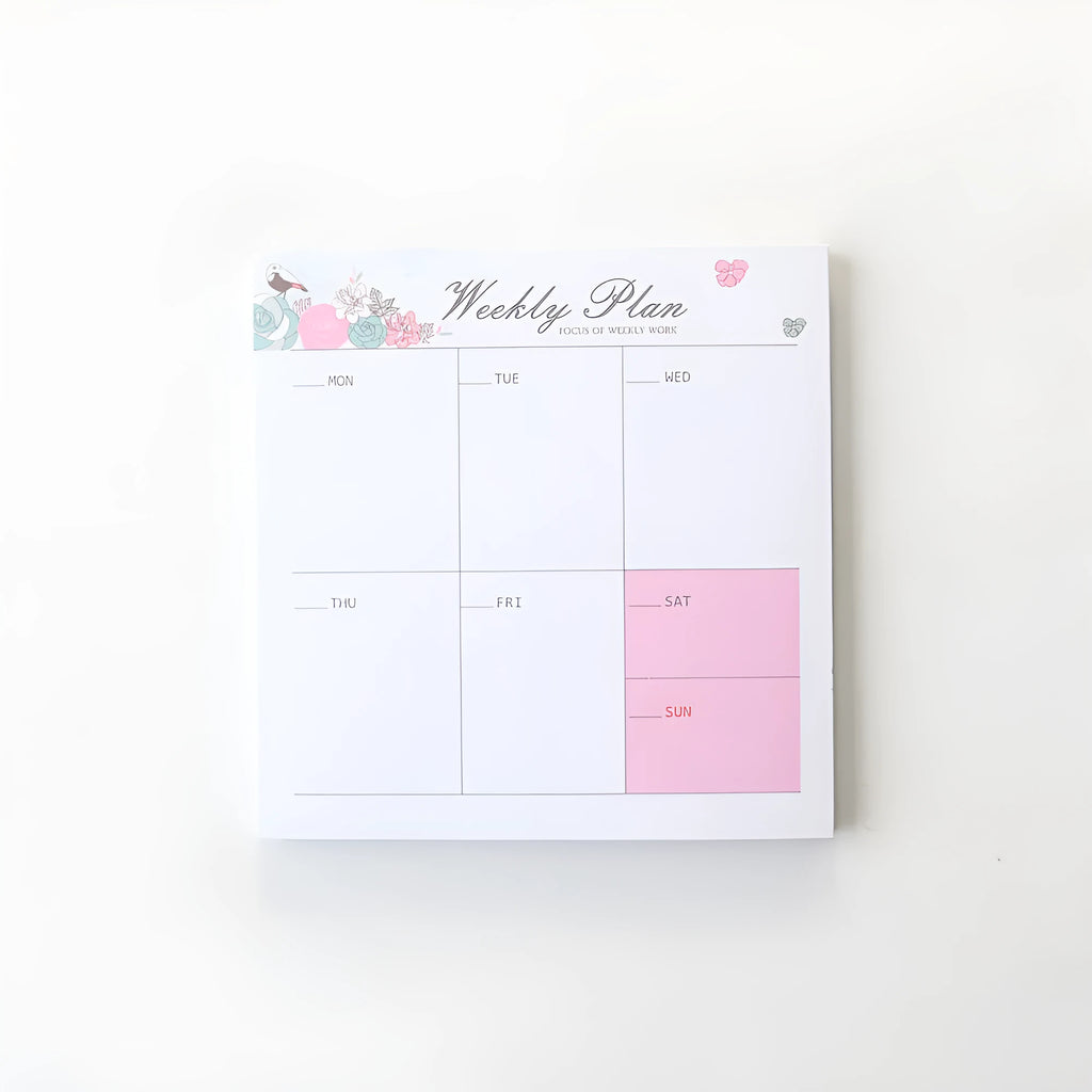 Domikee student desk organiser pad with pink and green planning pages showing weekly and monthly layouts