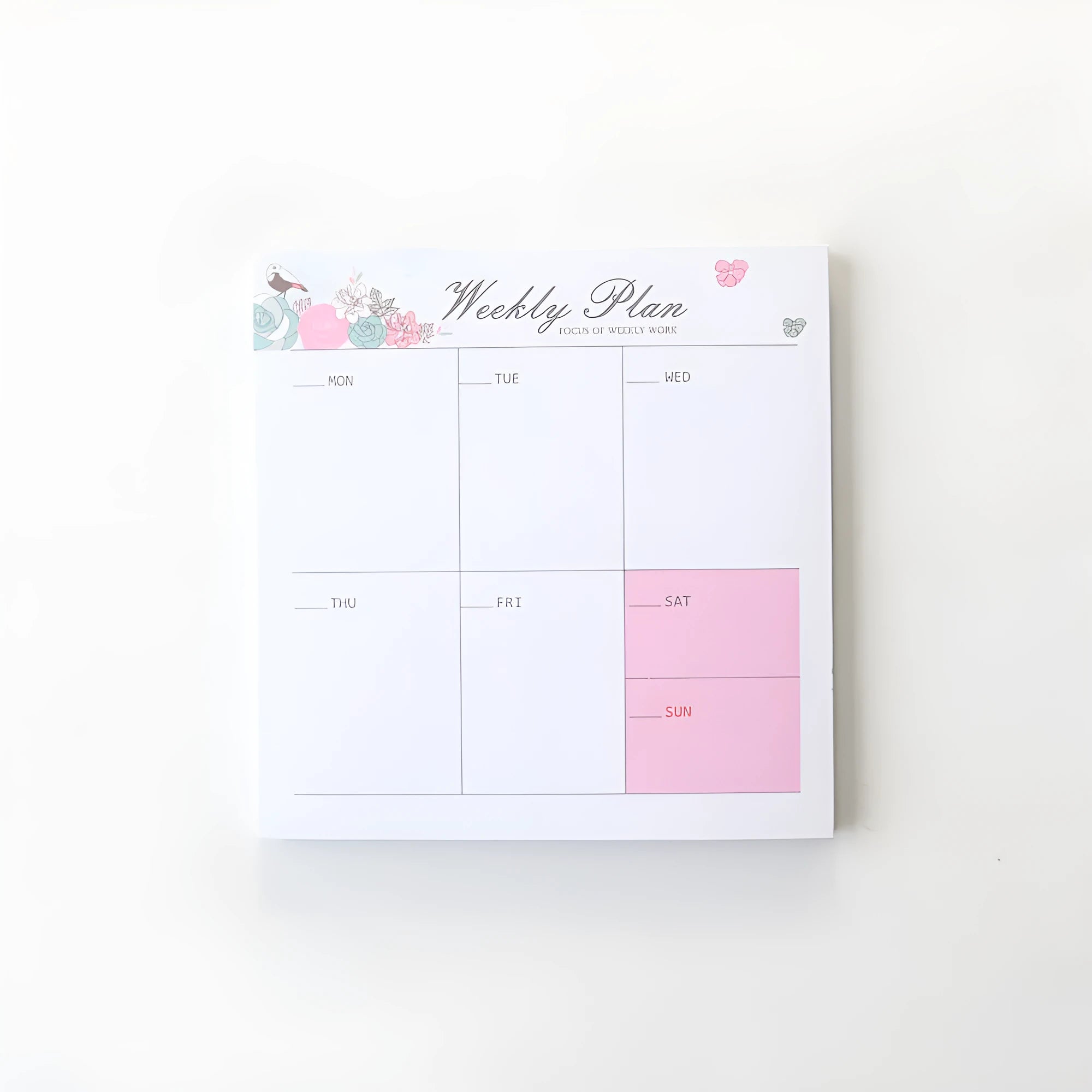 Domikee student desk organiser pad with pink and green planning pages showing weekly and monthly layouts