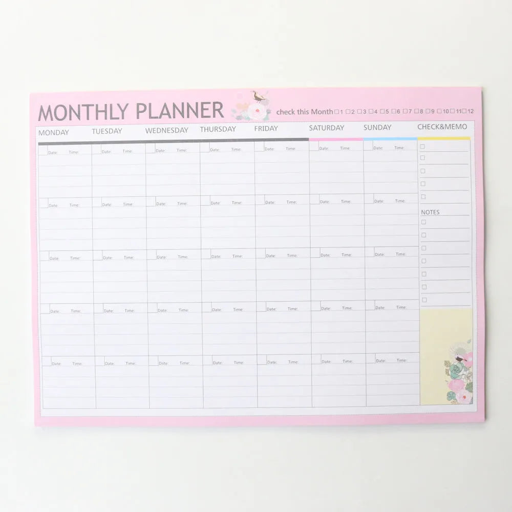 Domikee student desk organiser pad with pink and green planning pages showing weekly and monthly layouts