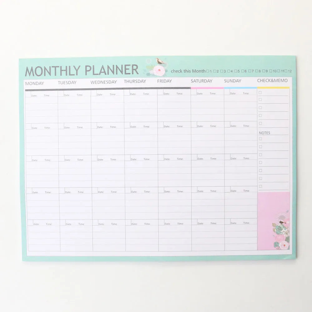 Domikee student desk organiser pad with pink and green planning pages showing weekly and monthly layouts