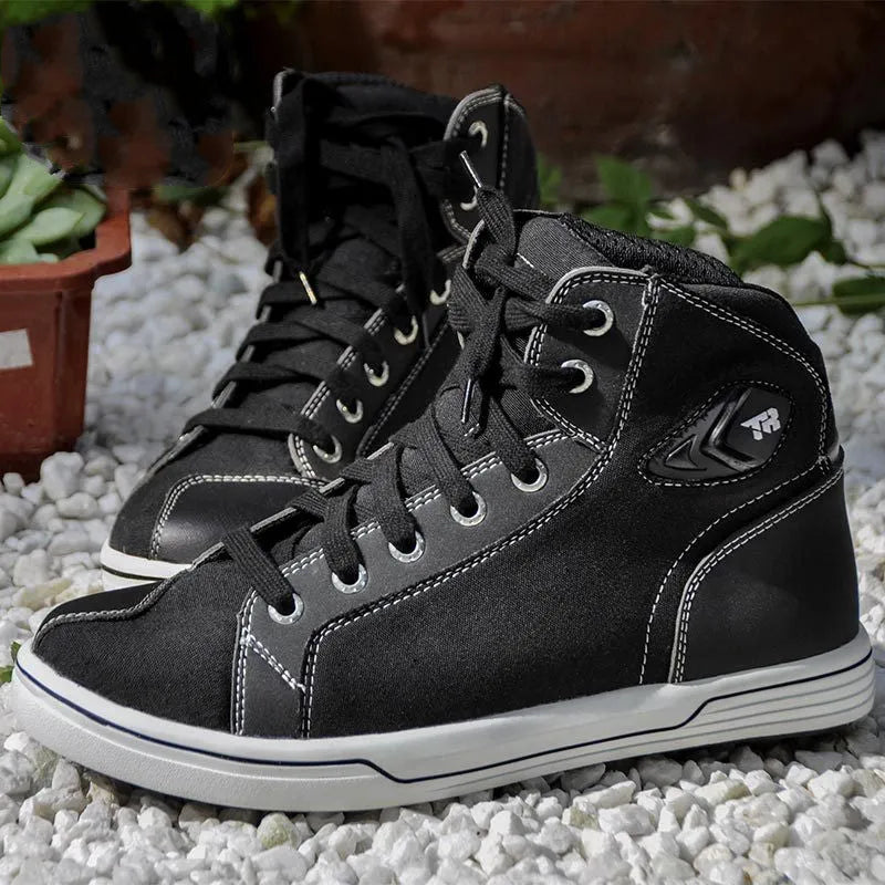 Tiger Boots black and grey casual motorcycle short boots with mesh panels, laces, and side zip on a plain background.