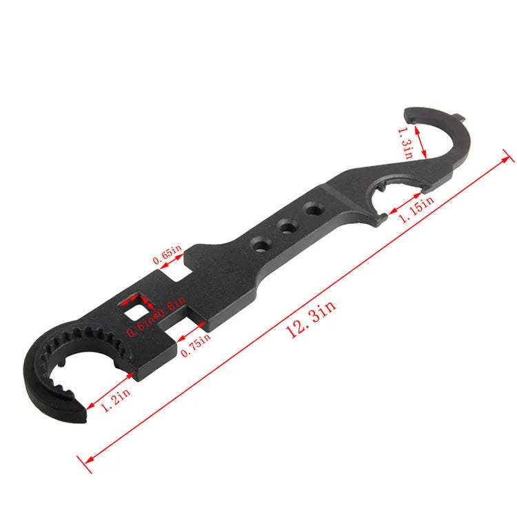 Black steel combination wrench for AR-15 and M4 rifle maintenance on a workshop bench.