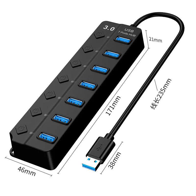 Black 7-port USB 3.0 hub with external power adapter and individual switches for each port on a desk.