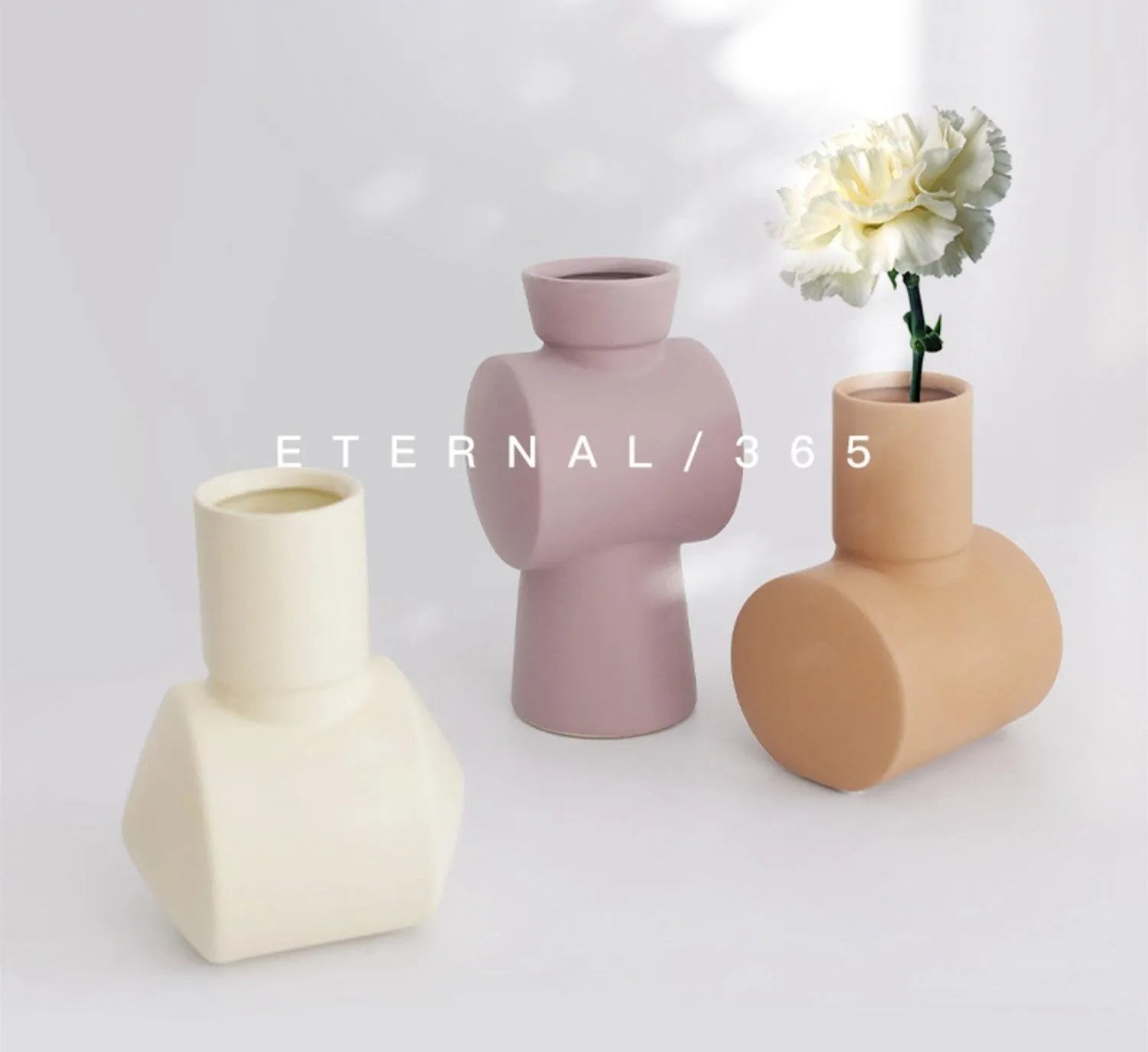 Nordic Morandi style ceramic vase with hammer texture in beige, brown, or purple colours.
