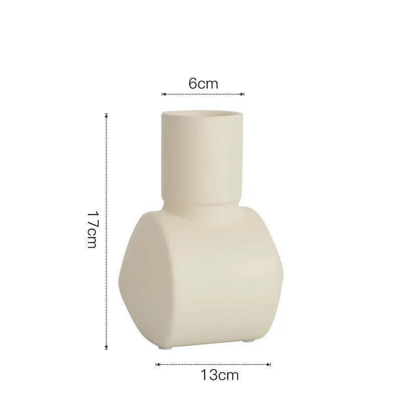 Nordic Morandi style ceramic vase with hammer texture in beige, brown, or purple colours.