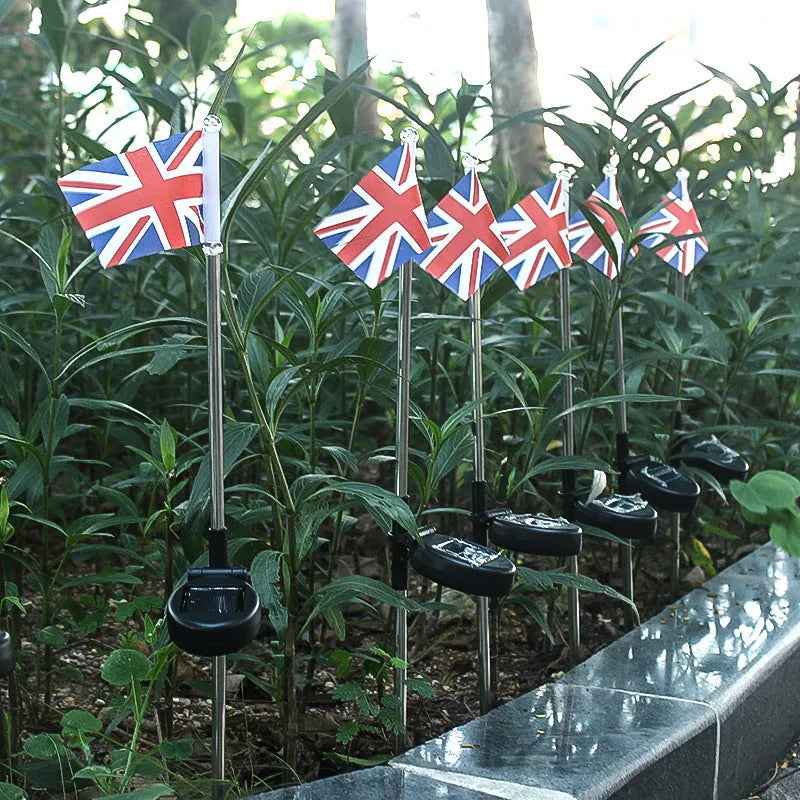 Solar-powered garden flag light with American flag design on stainless steel pole