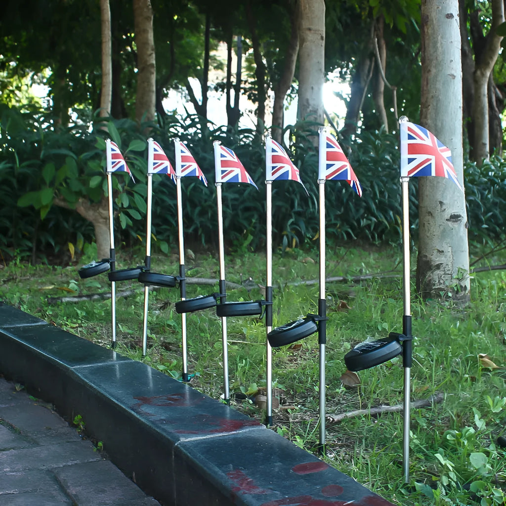 Solar-powered garden flag light with American flag design on stainless steel pole