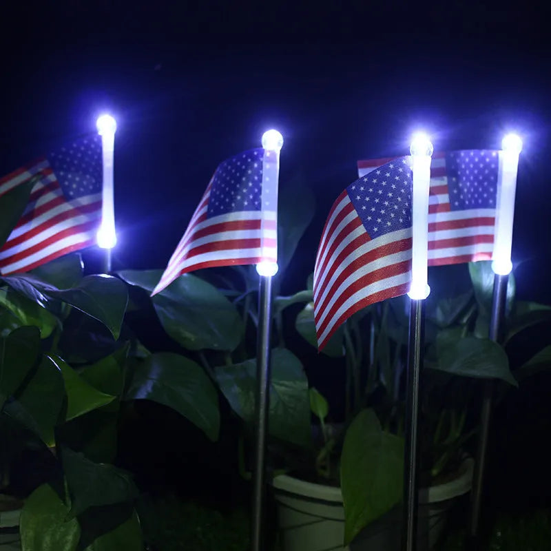 Solar-powered garden flag light with American flag design on stainless steel pole