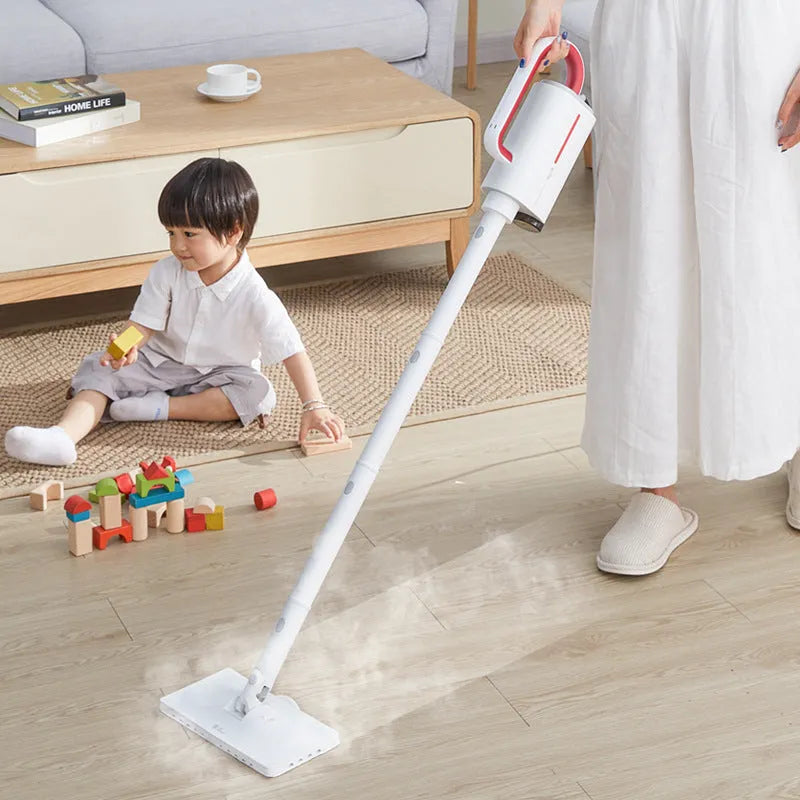 White Deerma DEM-ZQ610 steam cleaner unit with assorted brush heads including glass scraper and mop.