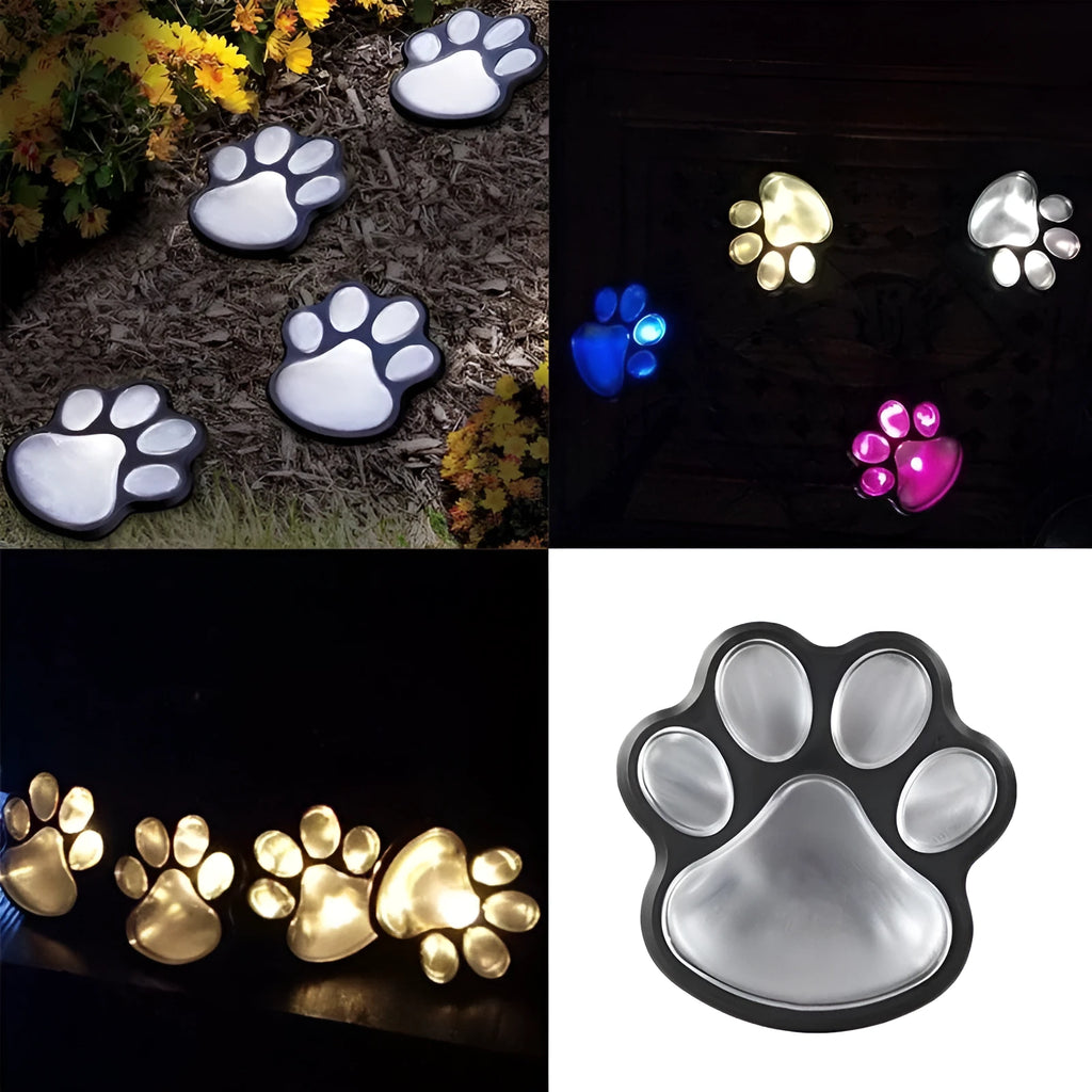 Black solar-powered bear paw print garden lights with four paw shapes and solar panel