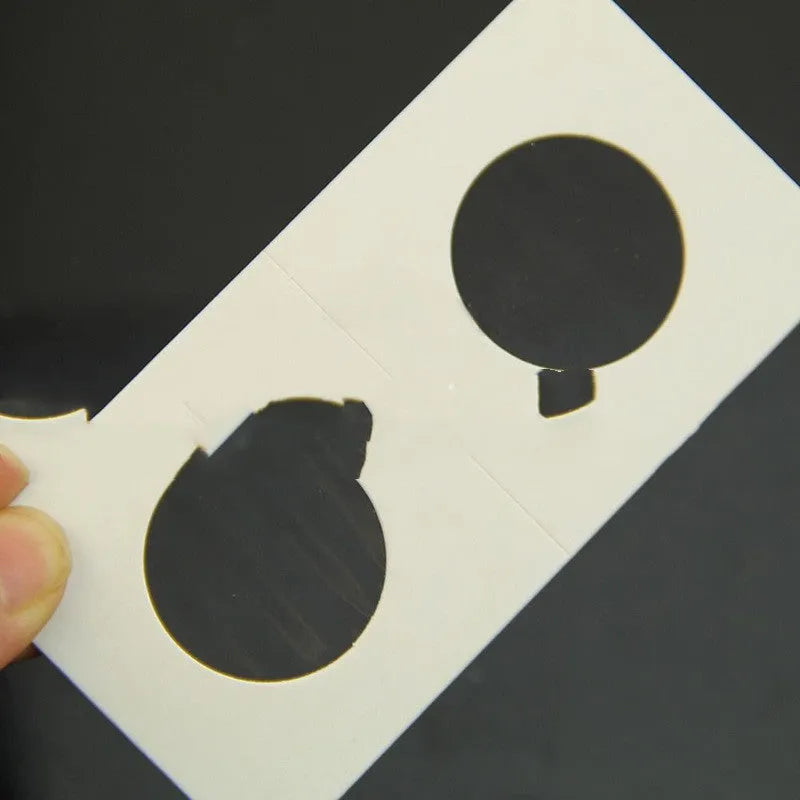 Set of 50 white paper coin protector clips for commemorative coins in a transparent OPP bag.